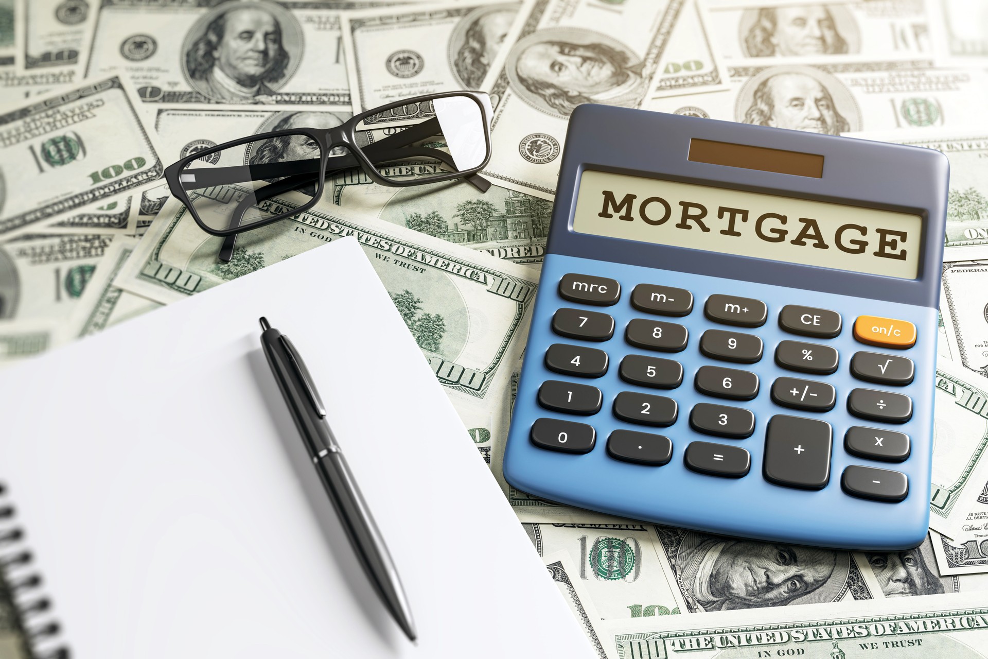 Calculator with Mortgage on screen, pen, notebook, glasses, and dollar bills on desk. 3D Rendering